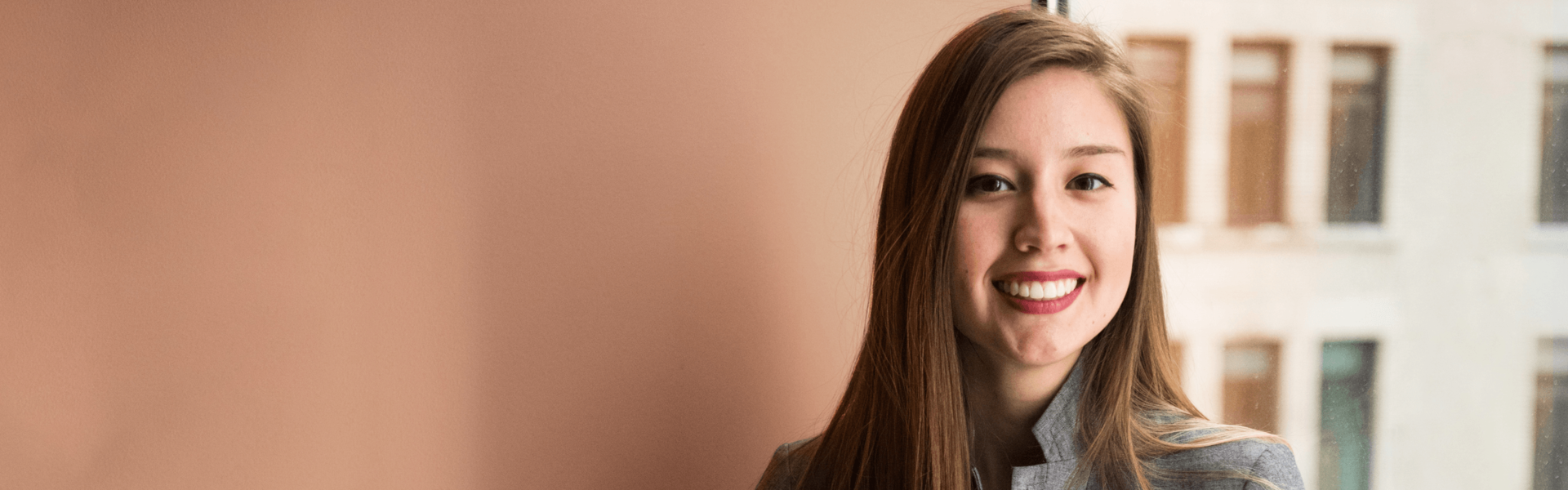 smiling woman with global mobility experience 